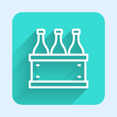 White line Bottles of wine in a wooden box icon isolated with long shadow background. Wine bottles in a wooden crate icon. Green square button. Vector