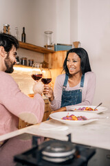 Happy Couple Making Toast at Home