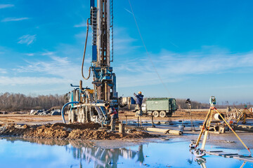 Close-up of a car-based drilling rig at a construction site. Drilling deep wells for mining.....