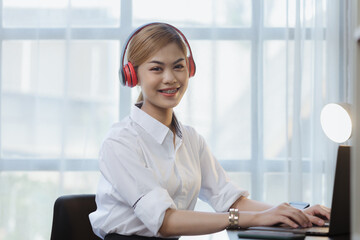 An Asian female employee in the office of a startup company, she is an employee of a startup company's finance and tax department. Concept of corporate finance and tax management.