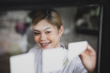 An Asian female employee in the office of a startup company, she is an employee of a startup company's finance and tax department. Concept of corporate finance and tax management.