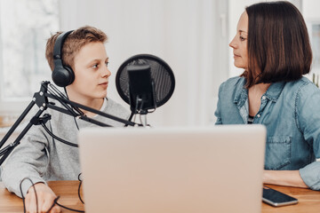 Mother and son record a podcast together
