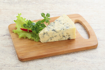 Blue cheese piece over board