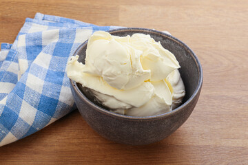 Italian soft mascarpone cheese in the bowl
