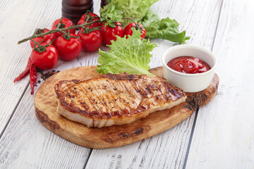 Grilled pork steak with ketchup