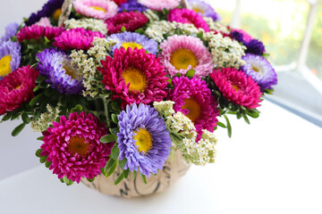 Fototapeta premium greeting card layout. bouquet of colorful asters and space for text