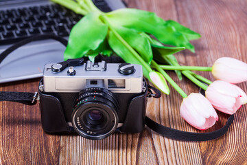 Retro camera on a wooden table