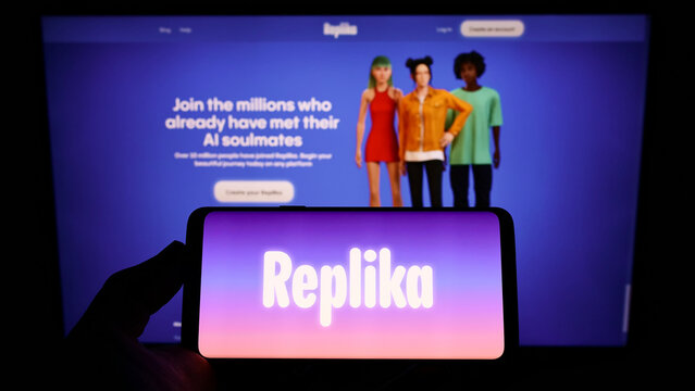 Stuttgart, Germany - 07-03-2022: Person holding cellphone with logo of US software company Luka Inc. (Replika AI) on screen in front of business webpage. Focus on phone display.