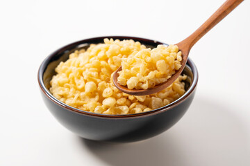 Tenkasu served in a bowl placed on a white background.
