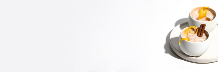 Delicious dessert , creamy rice pudding with cinnamon on whiteBackground.Banner with copy space