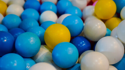 Ball game in the playground, Pile of toy balls made of plastic.