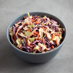 Homemade Coleslaw with Cabbage and Carrots in a Bowl, low angle view.