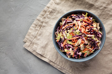 Homemade Coleslaw with Cabbage and Carrots in a Bowl, top view. Flat lay, overhead, from above.