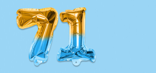 Rainbow foil balloon number, digit seventy one on a blue background. Birthday greeting card with inscription 71. Top view. Numerical digit. Celebration event, template. Banner