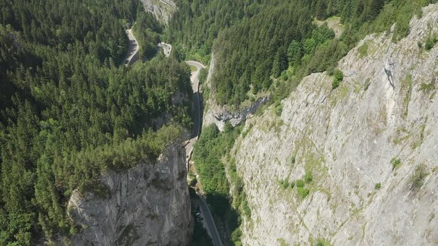 4k aerial video with the windy curved road from Cheile Bicazului Gorges in the Romanian Mountains. Amazing beautiful roads from Romania.