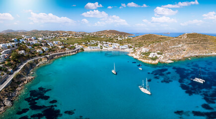 Panoramic aerial view of the popular beach at Vari, Syros island, Greece, with sailboats moored...