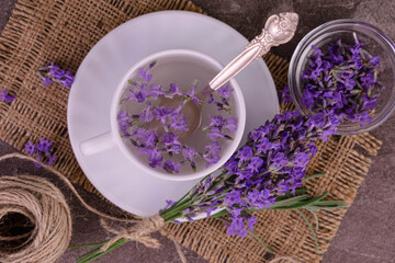 Aromatic lavender tea in a cup a bouquet of fresh lavender flowers. Flat lay.