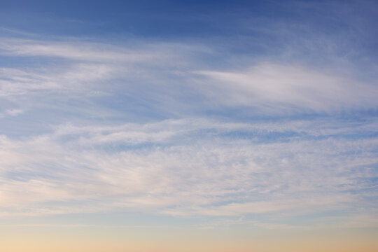 blue sky with high clouds at sunrise. beautiful nature background in morning light. fine weather forecast