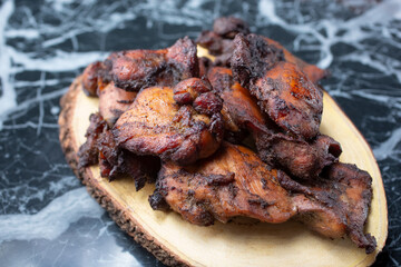 A view of a platter of jerk chicken.