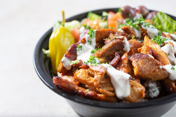 A closeup view of a chicken shawarma salad bowl.