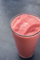 A view of a cold strawberry smoothie.