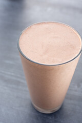 A view of a chocolate flavored fruit smoothie.