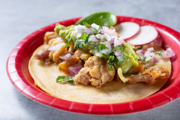 A closeup view of a pollo asado street taco.