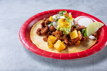 A view of an al pastor street taco.