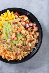 A top down view of a Mexican pollo asado bowl.
