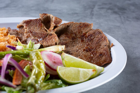 A view of a plate of carne asada.