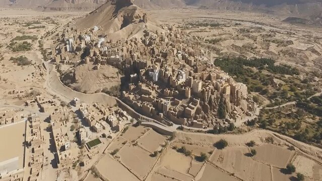 View to the city of Seiyun, Hadramaut valley, Yemen. Sayoun is a city in the Hadhramaut region of Yemen, today the largest city in the Hadhramaut Valley. (aerial photography)