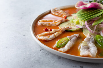 A closeup view of a plate of aguachile. 