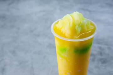 A view of a frozen passion fruit smoothie beverage.