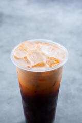 A view of a cold Thai tea beverage.