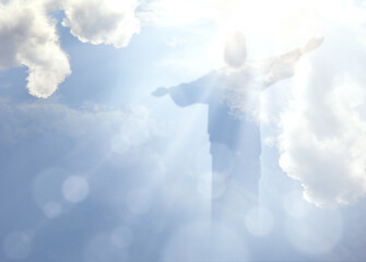 Ascension of Christ. Shining silhouette in the clouds - obrazy, fototapety, plakaty