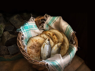 Five loaves and two fish in a basket