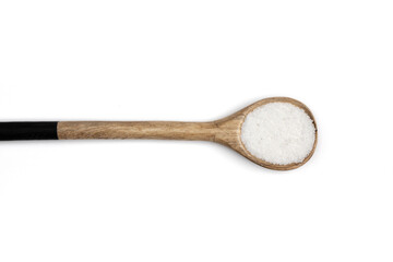 wooden spoon of sea salt isolated on white