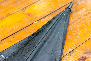 Closed wet umbrella black. Wet umbrella walking stick.