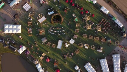 A dynamic top down descending aerial footage towards the Feria Masticar food festival in Buenos Aires City from a high altitude. Feria Masticar's slogan is “Eating well is good for you.”