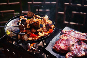 Grilled barbecued potato with vegetables and meat.