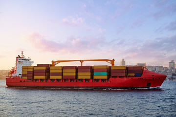 Fototapeta premium Big commercial cargo ship full of containers at Busphorus Turkey.