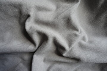 Simple gray wool, viscose and polyester jersey fabric in soft folds