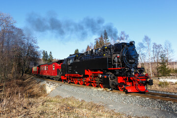 Obraz premium Brockenbahn steam train locomotive railway departing Drei Annen Hohne in Germany