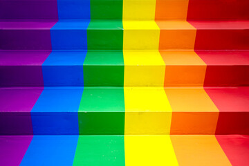 Pride Flag colors Rainbow Staircase for Pride month. Stairs painted in rainbow colors. Rainbow flag on concrete wall. Symbol of sexual minorities and tolerance. Gay pride flag LGBTQ