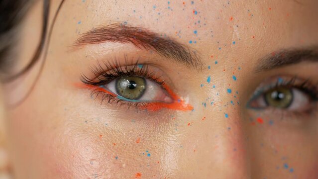 Crop woman with bright makeup