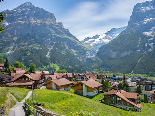 Fototapeta na wymiar View of Grindelwald village over surrounded mountains, Switzerland.