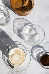Fototapeta na wymiar Coffee with ice. Dalgona coffee. Creamy coffee with ice and almond milk. Ideal drink for summer