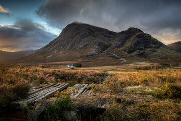 Looking towards the Lagangarbh mountain hut in Glen Coe  with the peaks of Buachaille Etive Mor in the background. Scottish Highlands - obrazy, fototapety, plakaty