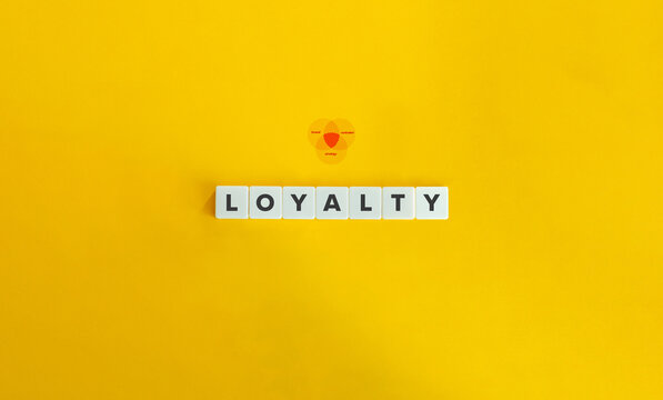 Customer Loyalty Banner and Concept. Text on Letter Tiles on Yellow Background. Minimal Aesthetics.