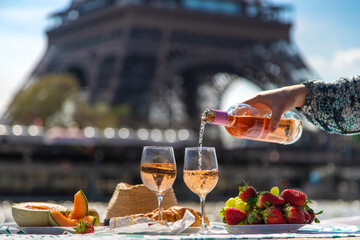 Picnic and wine near the Eiffel Tower. Selective focus.